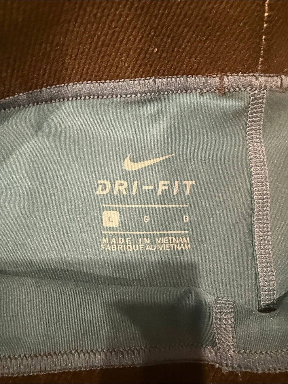 Nike Women's Teal Blue Performance Leggings with Subtle Print